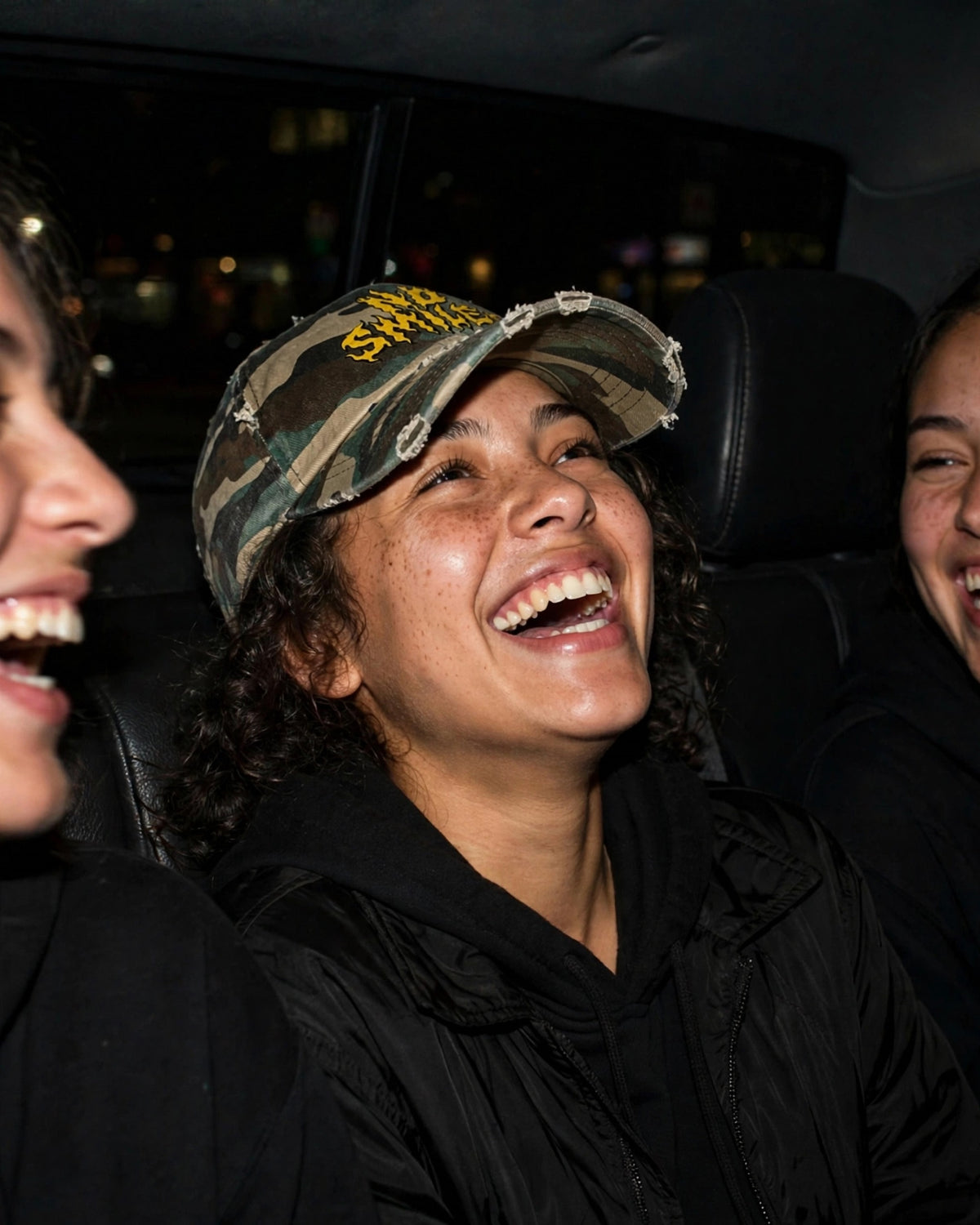 Distressed camo No Smiles hat, back seat